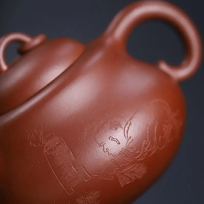 Reddish-brown handcrafted Yixing Zisha teapot with etched design from Scholar’s Rest