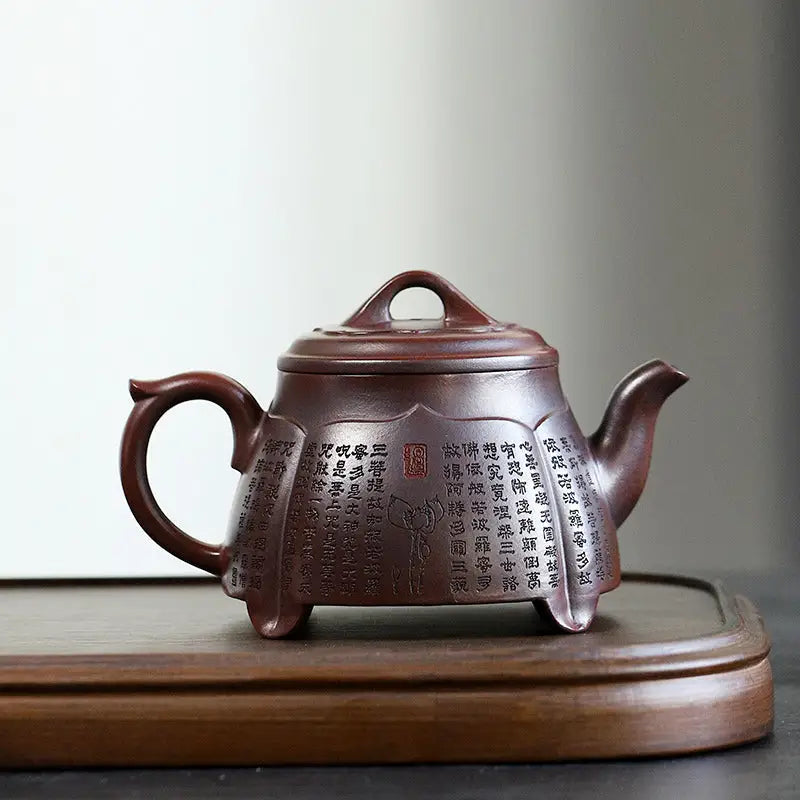 Brown ceramic teapot with inscriptions from Scripture Serenity, Yixing Zisha heart sutra design