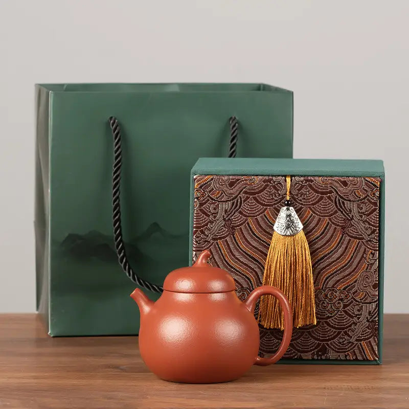 Earthenware teapot from Serenity Glow Tea Set made of authentic Yixing Zisha clay