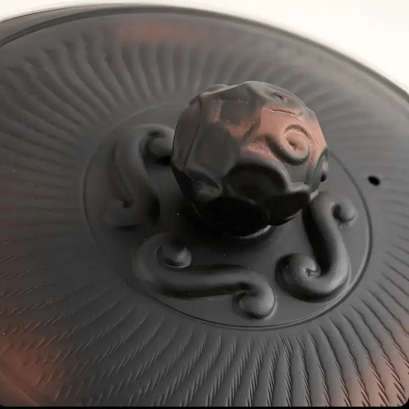Dark brown carved lid with knob on Shadow Lion Yixing Zisha Teapot Set