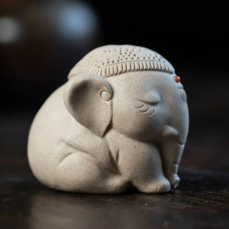 Silent Dharma ceramic elephant tea pet with decorative headpiece, Yixing Zisha style