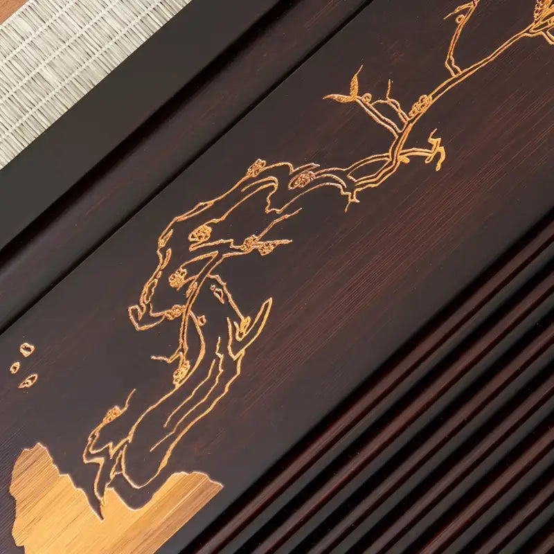 Dark wooden tray with golden floral design for Silent Grove bamboo gongfu tea table