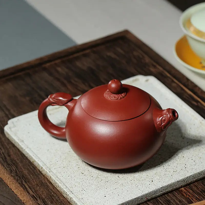 Reddish-brown Yixing Zisha Teapot Silent Sentinel with dragon-shaped handle and spout