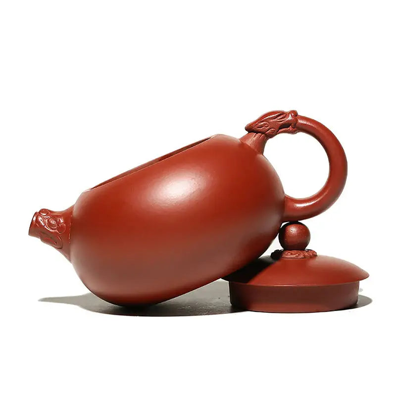 Reddish-brown Yixing Zisha teapot Silent Sentinel with dragon handle, authentic purple ceramic