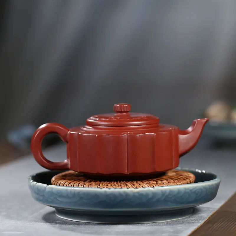 Red-brown ceramic Yixing Zisha clay teapot from Silken Ridge for authentic tea brewing