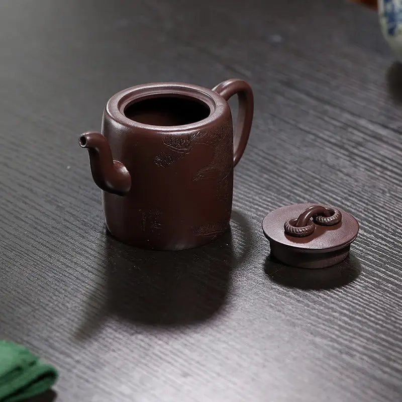 Brown Yixing Zisha Teapot with Carved Crane and Pine Motif from Soaring Tranquility
