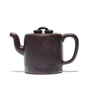 Brown Yixing Zisha teapot with carved crane and pine motif in Soaring Tranquility design