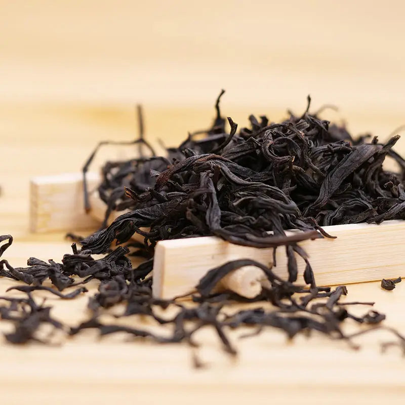 Loose black tea leaves for Sou Chong Red Tea Leave, perfect for teapots and tea sets