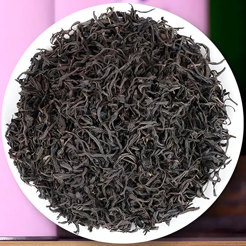 Loose dark dried tea leaves for Sou Chong Red Tea, perfect for brewing in teapots or mugs