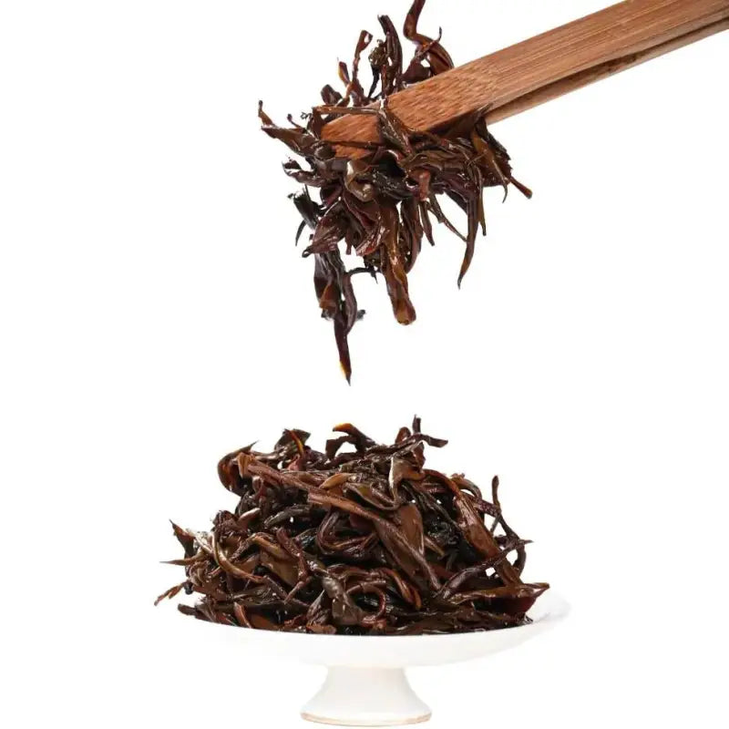 Loose dark tea leaves from Spring Beauty Tanyang Gongfu Black Tea showcasing tea craftsmanship