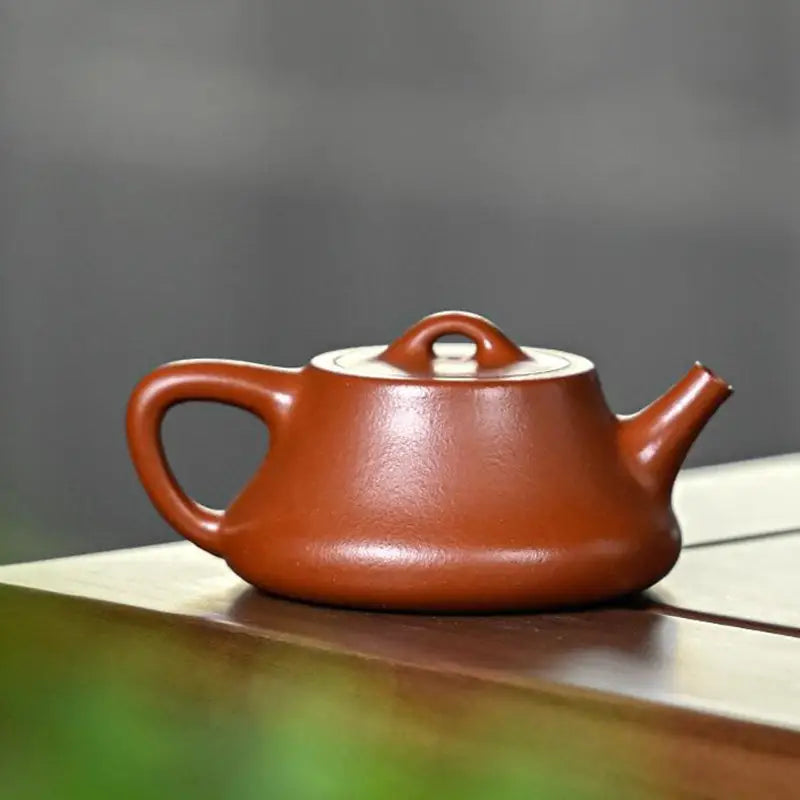 Brown ceramic teapot in Still Ember with 180ml capacity, made from Yixing Zisha Zhuni clay