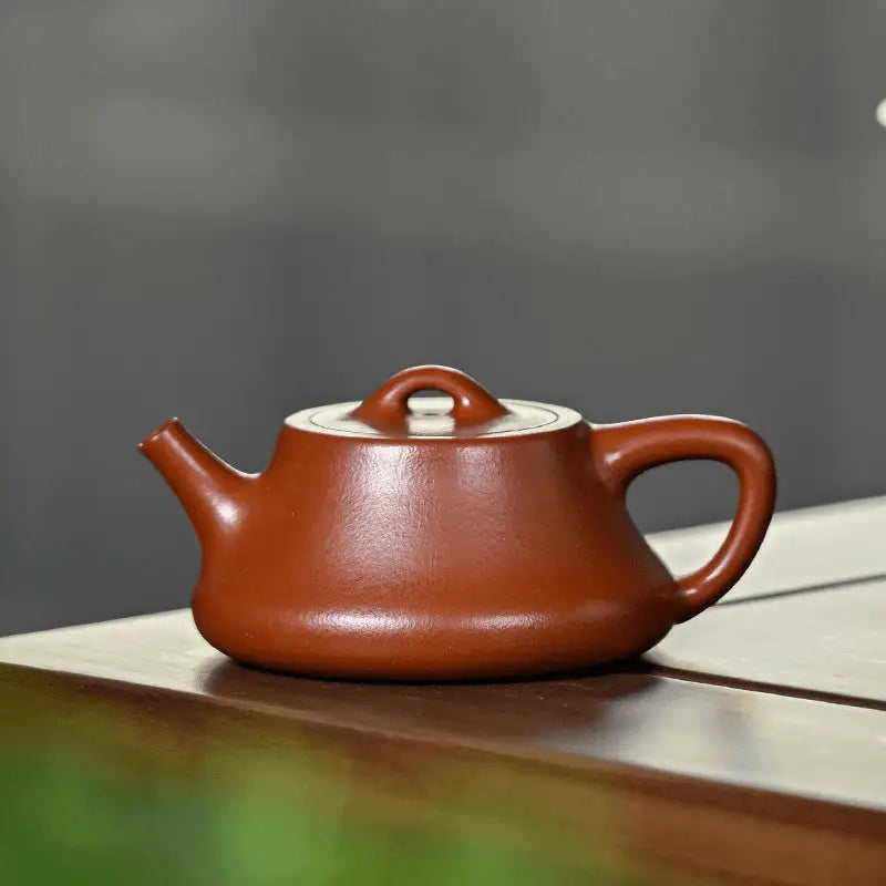 Brown ceramic teapot made of zhuni clay with 180ml capacity from Still Ember Yixing Zisha collection