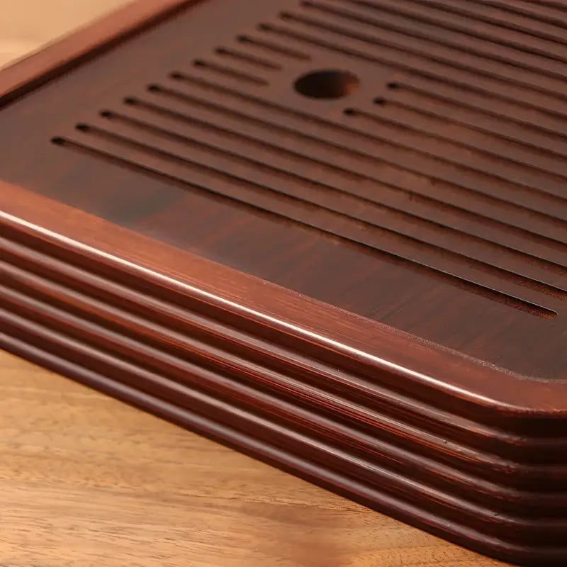 Dark brown wooden tea tray from Still Waters bamboo tea collection for elegant tea serving