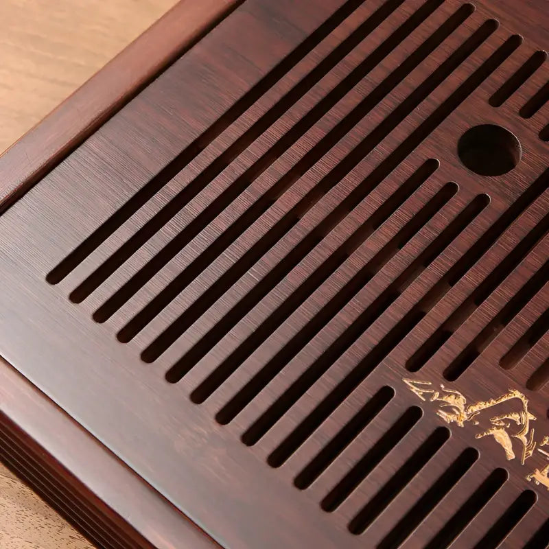 Slatted dark-stained wooden tea tray for bamboo tea servings, part of Still Waters collection