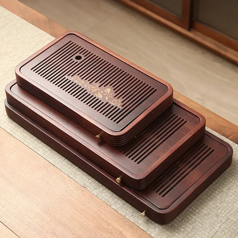 Stacked slotted bamboo tea tray for serving tea in Still Waters Bamboo Tea Tray collection