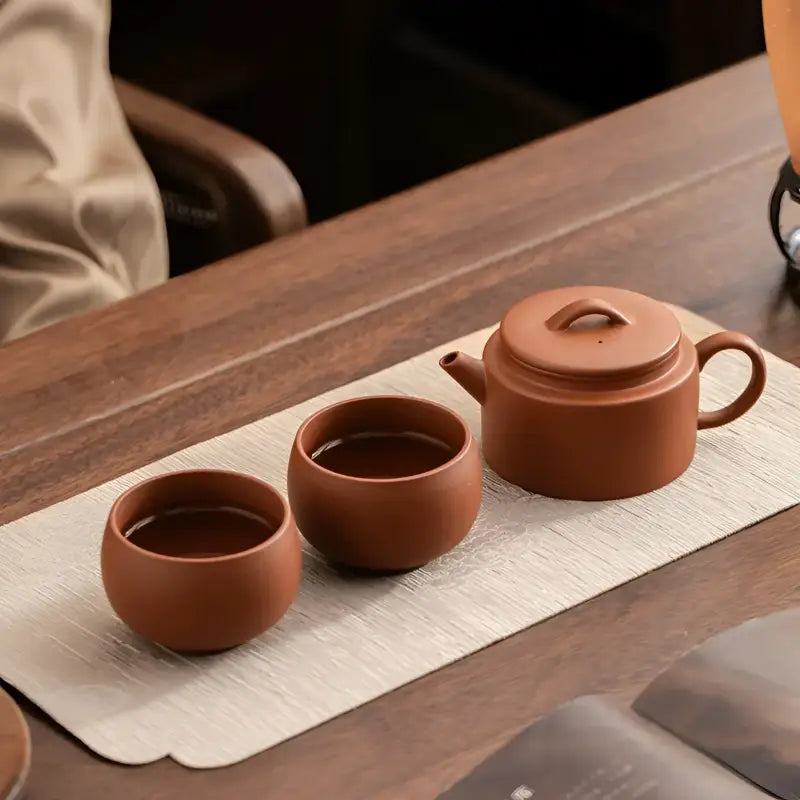 Earthenware Stillness Tea Set featuring Yixing Zisha teapots and cups for traditional tea brewing