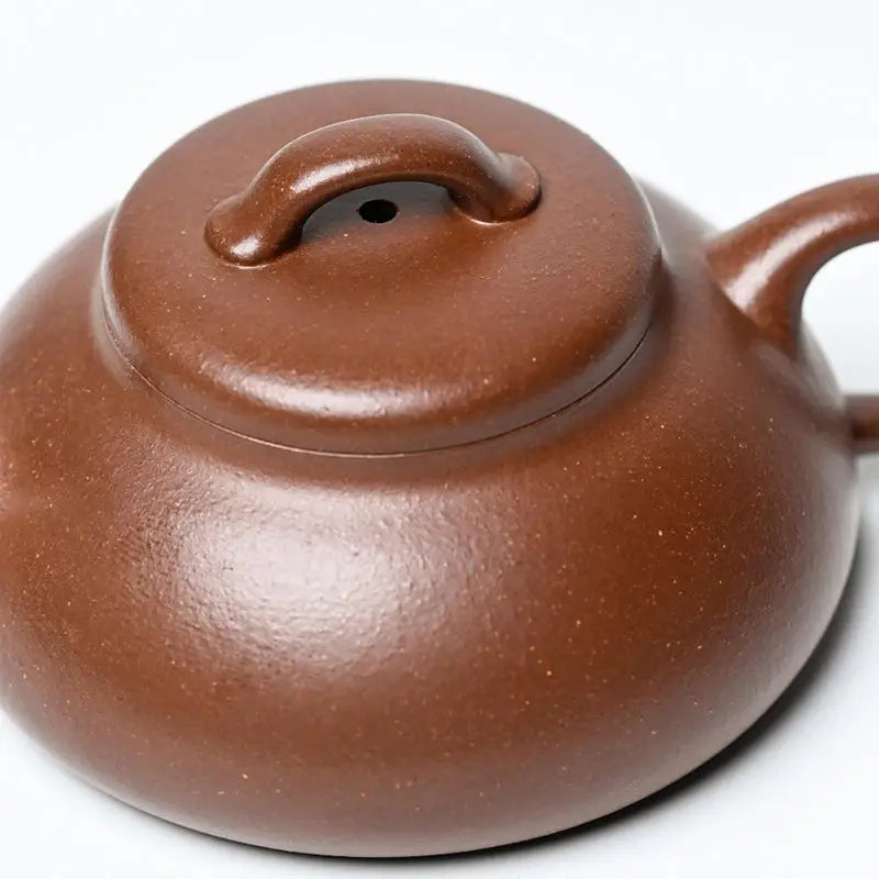 Brown ceramic teapot from Stone Ripple, ideal for Gongfu tea brewing in Yixing Zisha purple clay