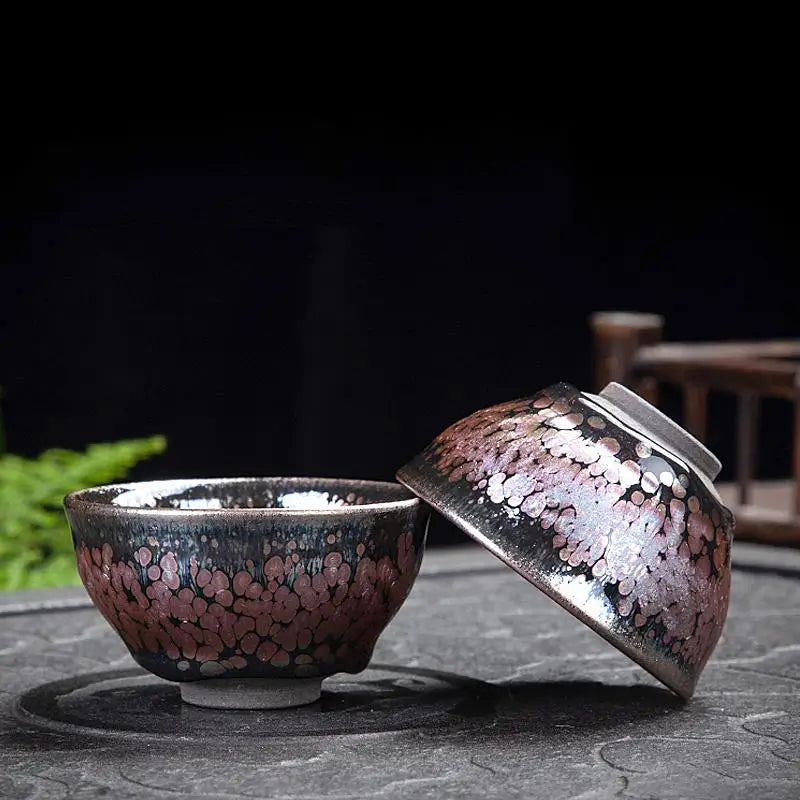 Ceramic tea bowls with mottled glaze from the Succulent Tea Set, crafted in Tenmoku Pottery style