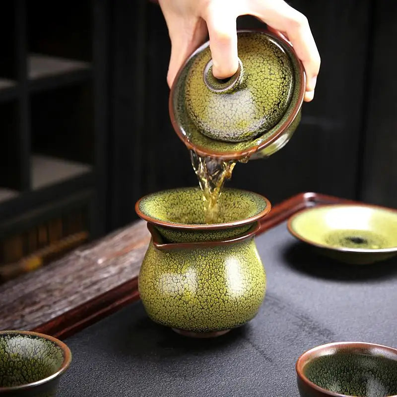 Green crackle-glazed sunflower tea set with Jianyang glaze for traditional gongfu tea brewing