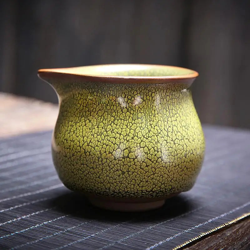 Green crackle-glazed ceramic pitcher from Sunflower Tea Set with Jianyang glaze for gongfu tea
