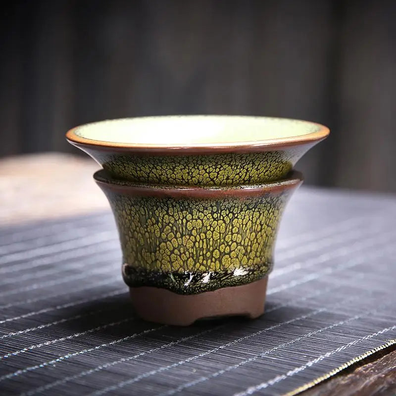 Green and brown ceramic tea strainer from Sunflower Tea Set with Jianyang glaze for gongfu tea