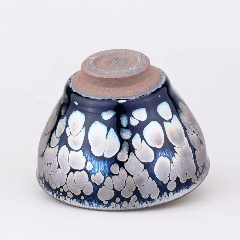 Dark blue and silver spotted handcrafted Jian Zhan zhan tea cup from Sunrise with radiant glaze