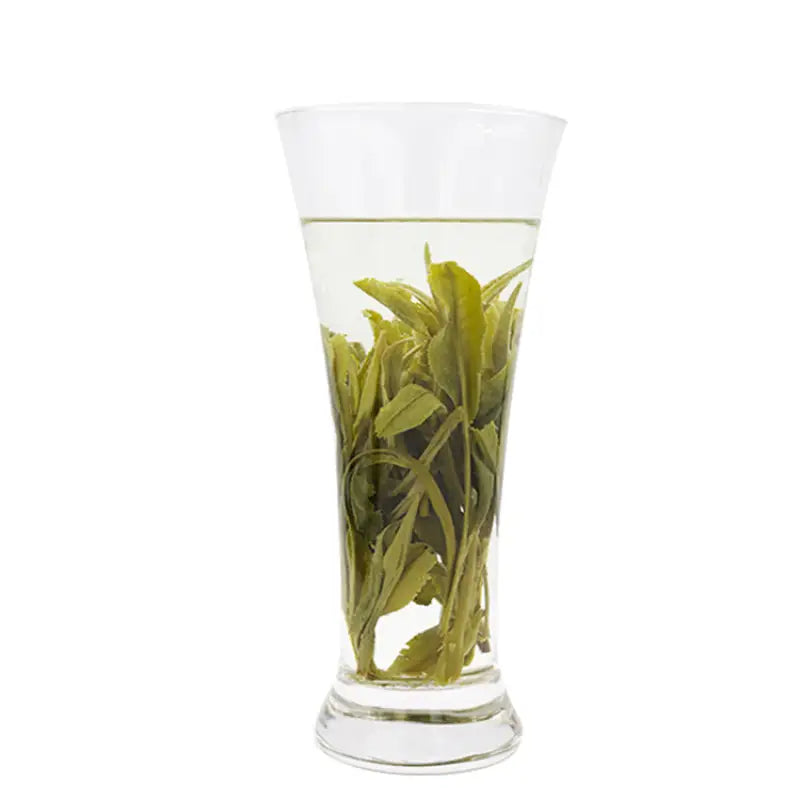 Tall glass of Taiping Houkui orchid aroma green tea with mountain freshness from spring harvest