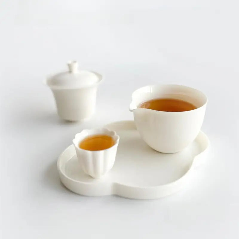 White tea set with tea showcasing Tanyang Black Tea Rose Rouge’s delicate floral aroma