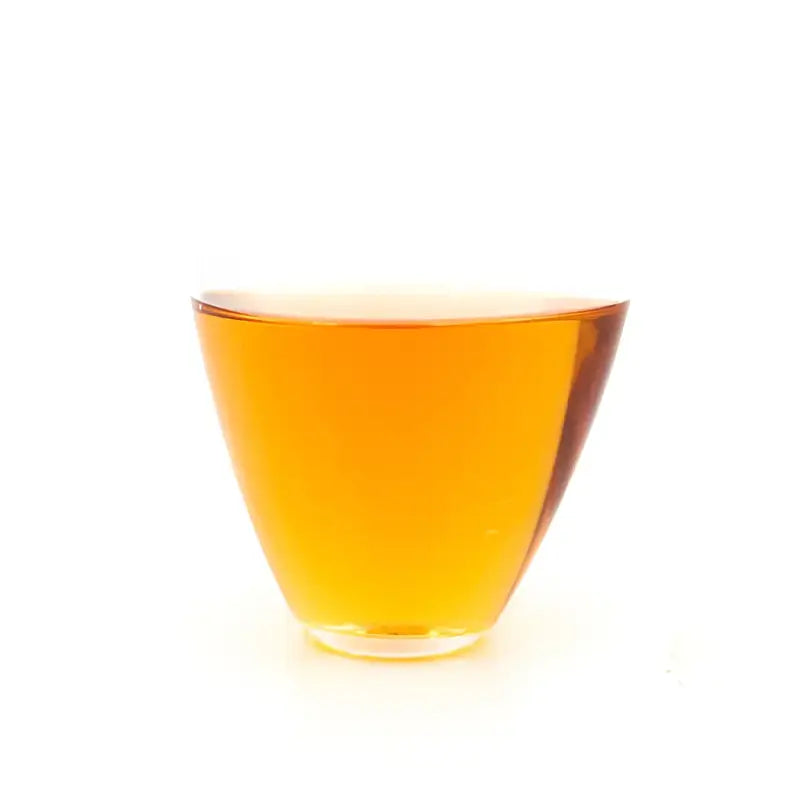 Amber liquid in a clear glass of Tanyang Black Tea with delicate floral aroma
