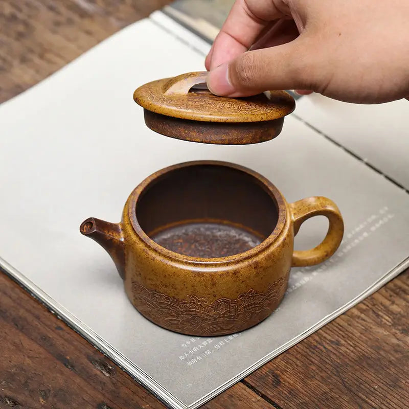 Earthenware Temple Ridge Yixing duanni teapot with detached lid showcasing craftsmanship