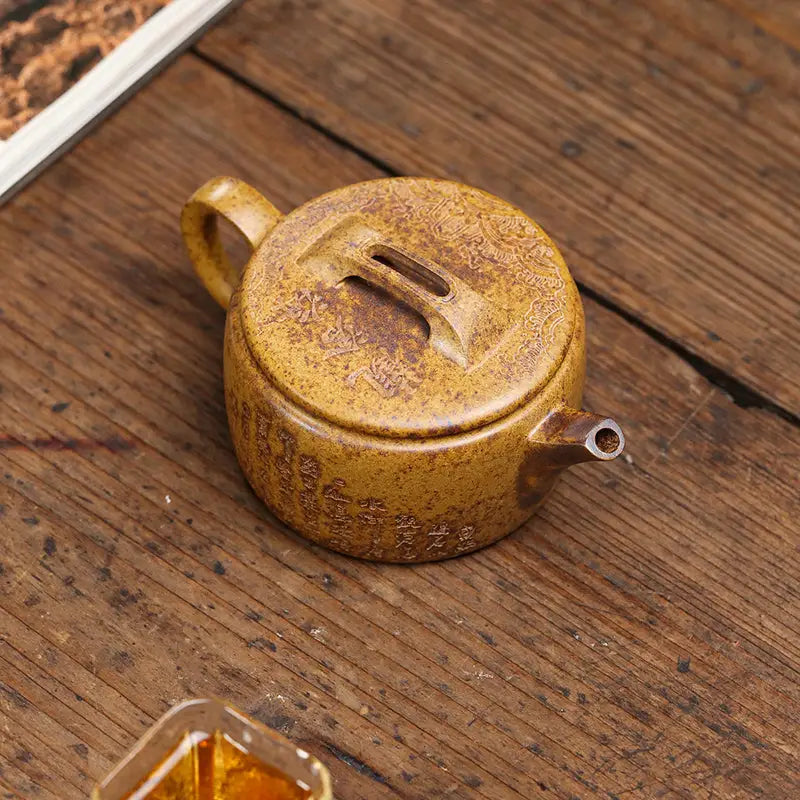 Round brown ceramic teapot from Temple Ridge, a Yixing Duanni Yixing Teapot collection