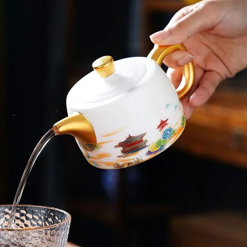 White and gold hand-painted Jingdezhen teapot with Asian-inspired design and golden accents