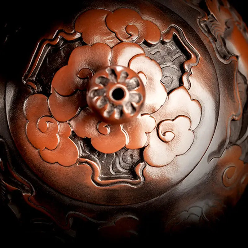 Ornate copper-colored incense burner lid for The Dragon Zitao Teapot showcasing Jianshui Purple style