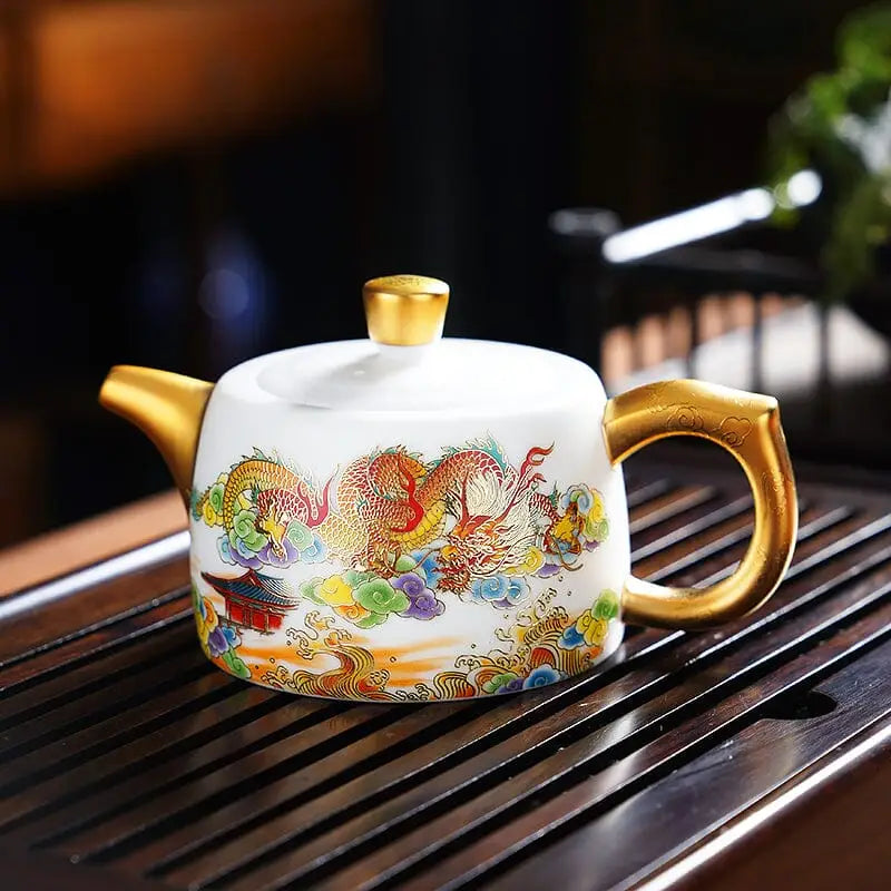 White hand-painted Jingdezhen teapot with dragon design and golden accents
