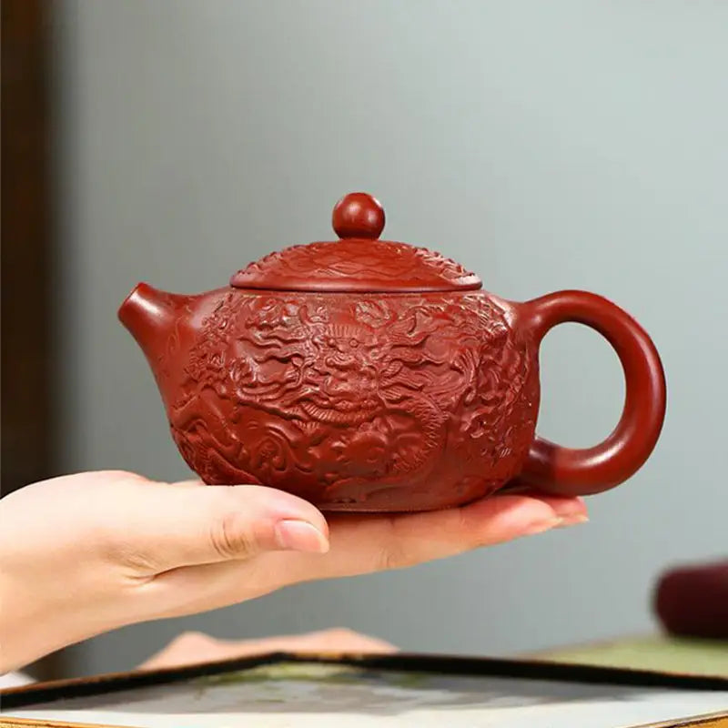 Red-brown Yixing Zisha clay teapot with intricate dragon relief from Imperial Roar