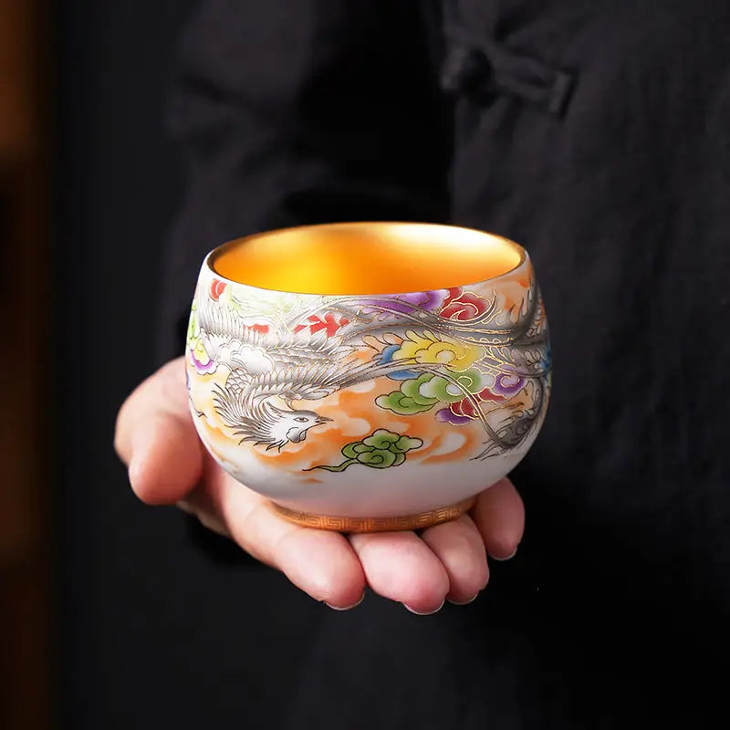 Ornate gold-lined porcelain tea cup from The Phoenix for gongfu tea brewing