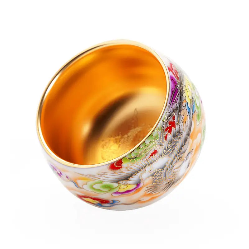 Ornate gold-lined porcelain tea cup from The Phoenix for gongfu tea brewing