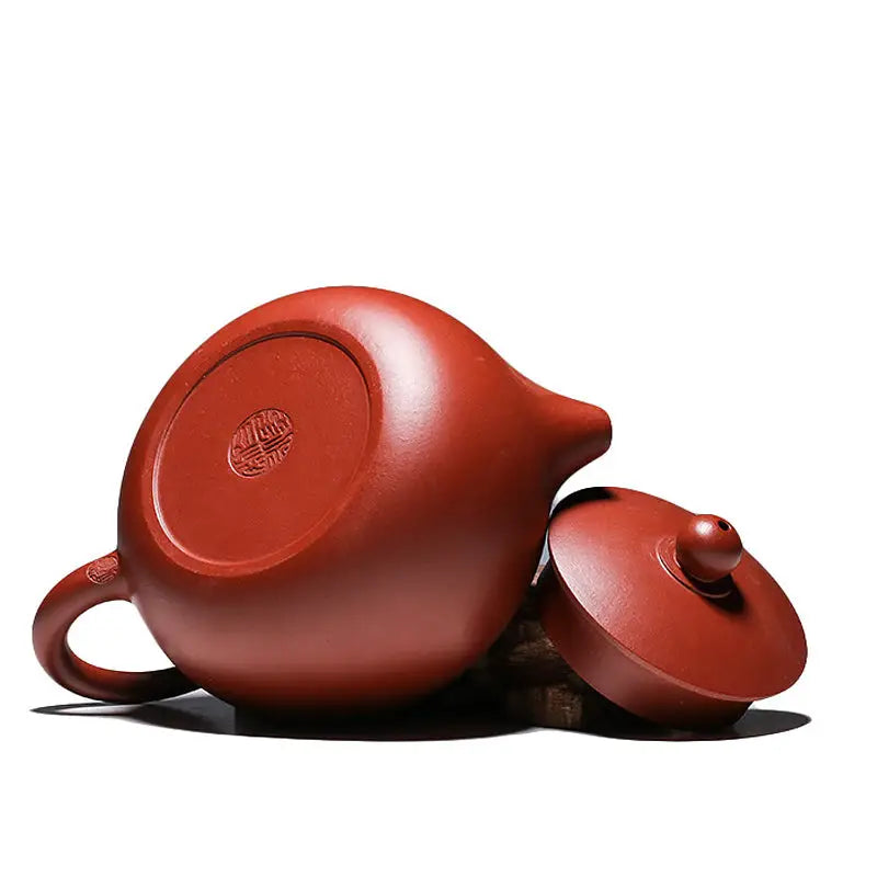 Reddish-brown handmade Yixing Zisha teapot with lid in Red Clay from The Still Moon