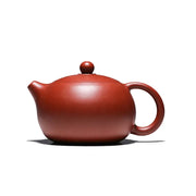Reddish-brown handmade Yixing Zisha teapot in red clay from The Still Moon