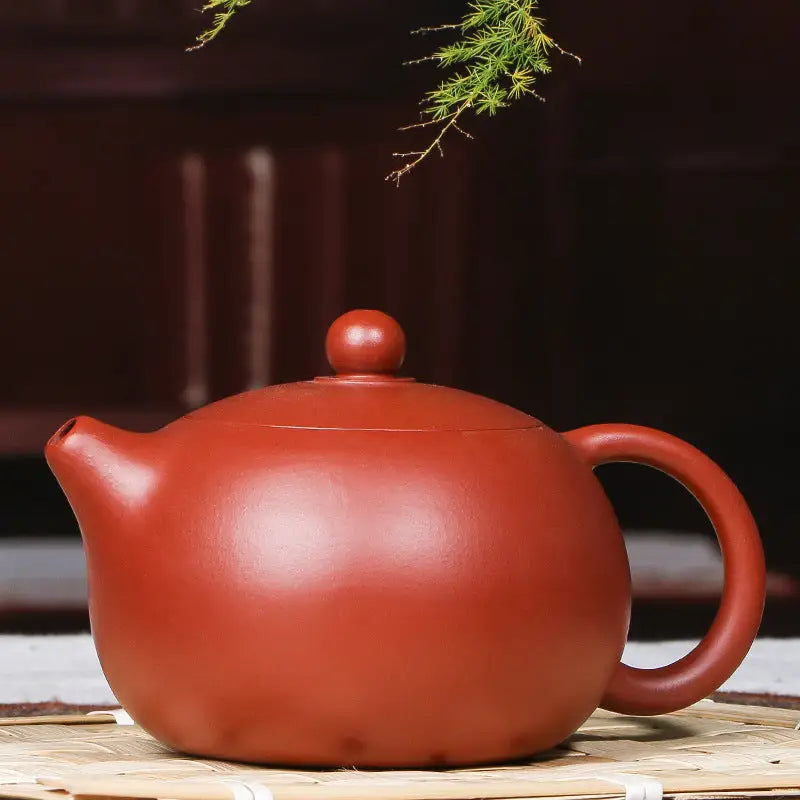 Reddish-brown handmade Yixing Zisha ceramic teapot from The Still Moon in red clay