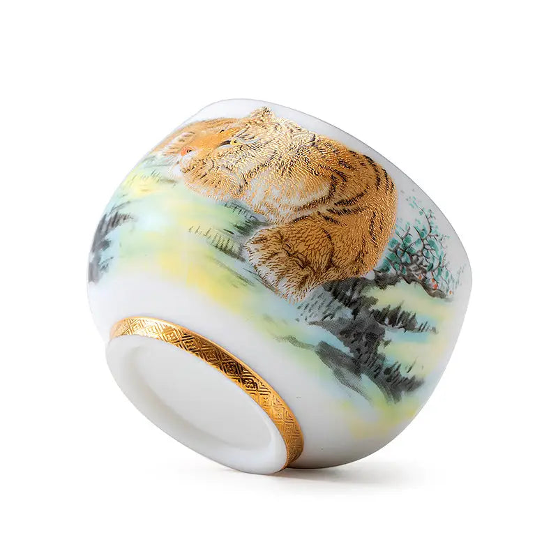 Porcelain cup with tiger design and gold trim from The Tiger tea set, ideal for Gongfu tea
