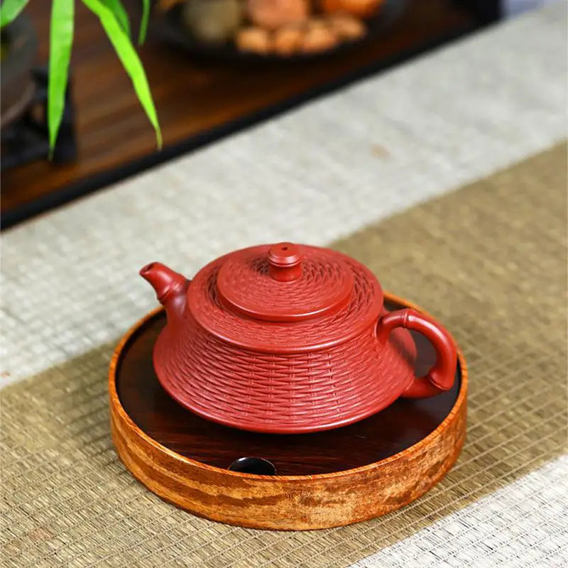 Red woven-textured Zisha teapot from The Woven Harmony, crafted in Yixing Zisha Clay