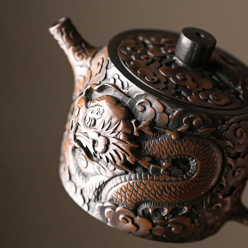 Ornate three-dimensional dragon carved teapot made of Jianshui Zitao, a unique teapots design
