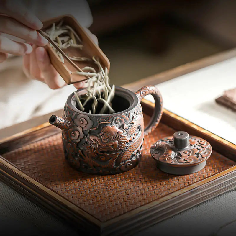 Three-Dimensional Dragon jianshui zitao teapot with lid showcasing dragon design