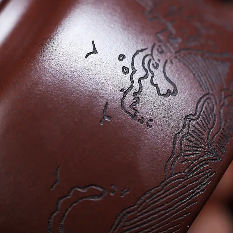 Engraved brown pottery Tidal Horizon Yixing Zisha teapot for elegant tea brewing
