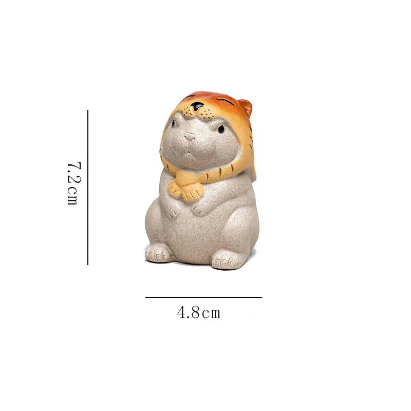 Ceramic rabbit figurine with tiger hat and scarf, ideal for Yixing tea pet Feng Shui tea ritual