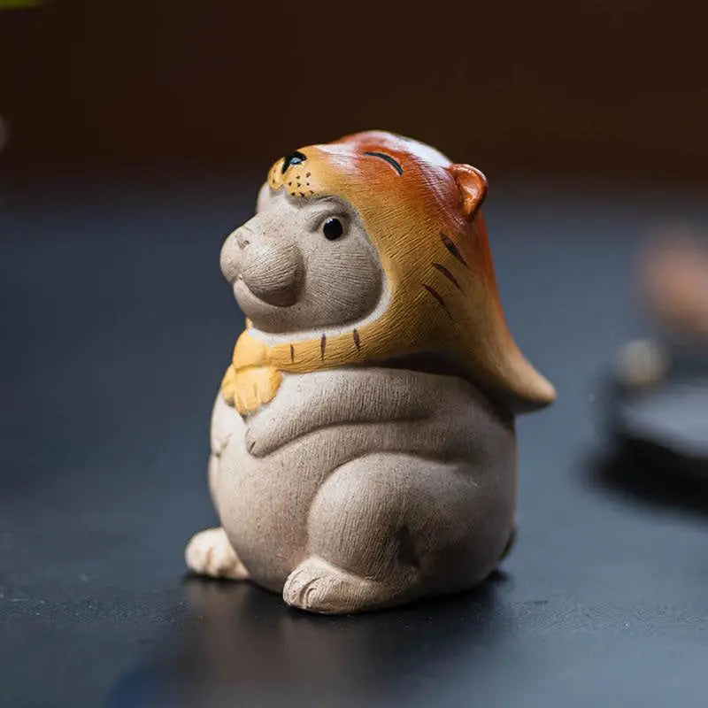 Ceramic Tiger Spirit Hammy figurine with tiger hood, ideal as yixing tea pet for feng shui tea ritual