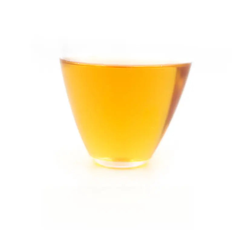 Glass of amber liquid showing Tongmu Jin Jun Mei black tea 2025 Golden Eyebrow