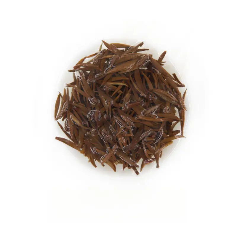 Pile of dried brown Jin Jun Mei black tea leaves for Tongmu Jin Jun Mei 2025