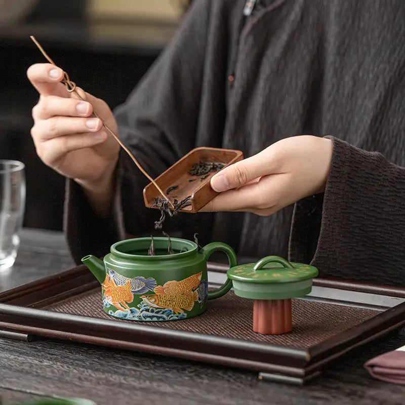 Green zisha clay teapot with fish design from the Tranquil Fir Tea Set, Yixing Zisha style